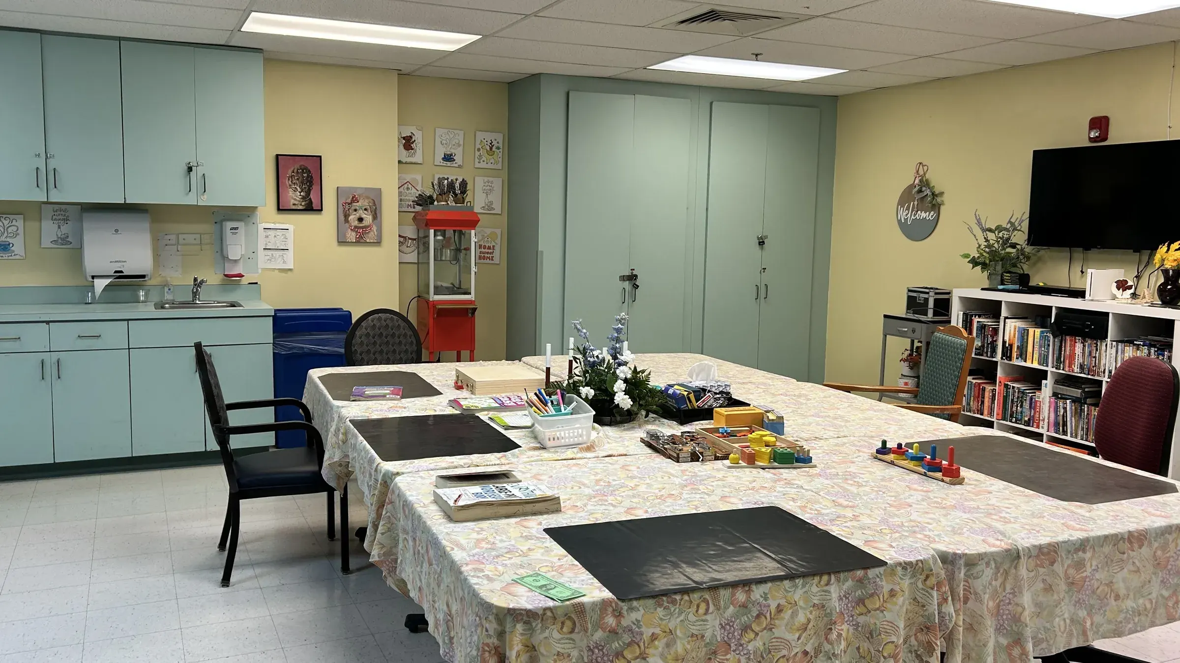 The craft room at Vivo Healthcare Harbourwood, games and puzzles laid out on the table